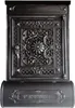 A detailed, antique-style black mailbox with ornate carvings and a key in the lock. Produktbild-Vorschau