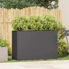 A dark gray planter box filled with green bushes sits on a lawn in front of a wooden fence. Produktbild-Vorschau