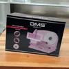 A pink meat slicer is shown on its packaging box, which is placed on a wooden surface. Náhľad obrázku produktu