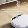A white robot vacuum cleaner is shown on a light wood floor, with a portion of a sofa visible in the background. Text overlays highlight the product's slim body and cleaning capabilities. Produktbild-Vorschau