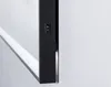 A close-up view of a black framed mirror with a light switch on its side, mounted on a white wall. Produktbild-Vorschau