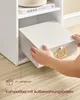 A person's hands are shown placing a white storage box into a white shelf unit. Produktbild-Vorschau