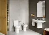 A modern bathroom with a toilet, bidet, and sink. Podgląd zdjęcia produktu