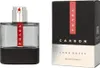 A product shot of Prada Luna Rossa Carbon Eau de Toilette for men and its packaging. Produktbild-Vorschau