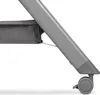 A close-up of the base of a grey baby crib with a wheel. Produktbild-Vorschau