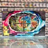 A Pokémon TCG: Morpeko V Union Special Collection box is displayed on a shelf, with other products blurred in the background. Voir les images du produit