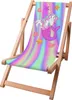 A wooden deck chair with a colorful fabric seat featuring a mermaid unicorn illustration and a pastel striped background. Náhľad obrázku produktu