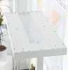A close-up shot of a white LED floor lamp with its light panel visible. Produktbild-Vorschau