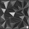 A close-up, studio shot of a 3D wall panel with a geometric, faceted design. Produktbild-Vorschau