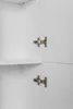 Interior view of a white cabinet with hinges visible. Podgląd zdjęcia produktu