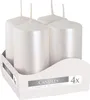 Four white pillar candles in a cardboard display box. Anteprima dell’immagine prodotto