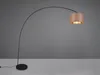A black arc floor lamp with a bronze lampshade is shown against a gray background and on a white surface. Produktbild-Vorschau