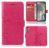A collage of images showing a pink flip phone case with a floral pattern, a phone inserted into the case, and a close-up of the case's interior card slots. Produktbild-Vorschau