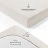 Close-up views of a fitted sheet, highlighting its texture and features. Produktbild-Vorschau