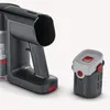 A close-up shot of a cordless vacuum cleaner's handle and a detachable battery pack against a white background. Produktbild-Vorschau