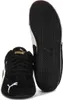 A pair of black Puma Speedcat sneakers are shown against a white background. One shoe is shown from the front, and the other is shown from the sole. Voir les images du produit