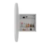 A white oval medicine cabinet with its door open, displaying various toiletries and cosmetic products on glass shelves. Podgląd zdjęcia produktu