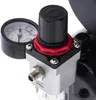 A close-up view of an airbrush compressor regulator and pressure gauge. Podgląd zdjęcia produktu