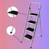 A four-step metal stepladder with black treads, set against a gradient background. Náhled obrázku produktu