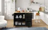 A kitchen island cart is shown in a well-lit kitchen setting, with cabinets and a sofa visible. Voir les images du produit
