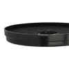 A close-up, side-view of a round black charcoal filter with a gray tab on the side. Produktbild-Vorschau
