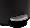 A close-up view of the pedal mechanism of a black trash can. Náhľad obrázku produktu