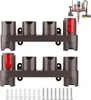 Two brown racks designed to hold vacuum cleaner accessories, with a small inset image of a vacuum cleaner and its attachments in the top right corner. Screws and wall anchors are visible at the bottom. Produktbild-Vorschau