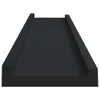 A black shelf or picture ledge is shown from a slightly elevated angle against a white background. Produktbild-Vorschau