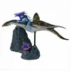A toy figure of a Na'vi character riding a sea creature, displayed on a rocky, coral-like base. Produktbild-Vorschau
