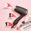 A dark gray ProfiCare hairdryer is displayed on a light pink background, surrounded by makeup brushes, sponges, and an eyeshadow palette. Red arrows point to different features of the hairdryer, with German text labels. Anteprima dell’immagine prodotto