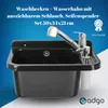 A black sink with a chrome faucet and soap dispenser is shown against a blue and white gradient background. Anteprima dell’immagine prodotto