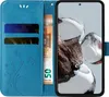 A blue flip cover phone case with card slots and a euro banknote is shown next to a smartphone. Produktbild-Vorschau