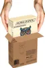 Hands are holding a wooden puzzle box above an open cardboard shipping box. Náhled obrázku produktu