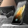 A rugged phone case with a kickstand is displayed in a studio setting with textured surfaces. Náhled obrázku produktu