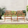A wooden patio set with two chairs and a table, placed on a rug outdoors. Náhľad obrázku produktu