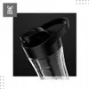 Close-up of the lid and upper part of a black and transparent blender bottle. Podgląd zdjęcia produktu