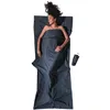 A woman is lying on a sleeping bag. Produktbild-Vorschau