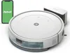 A white robot vacuum cleaner with a charging dock and a smartphone displaying the iRobot app, all on a white background. Náhľad obrázku produktu