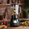 A close-up shot of a Russell Hobbs blender filled with fruits and vegetables, set on a wooden countertop. Anteprima dell’immagine prodotto