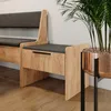A modern interior setting with a wooden bench and a plant in a copper pot. Podgląd zdjęcia produktu