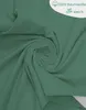 A close-up of a green fabric, likely a pillowcase, with a swirl pattern. Produktbild-Vorschau