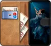 A book-style phone case is open, showing a credit card and euro banknotes inside, with a smartphone displaying an image on its screen. Náhled obrázku produktu