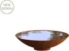 A rusty metal bowl filled with water, with a "NEW DESIGN" badge in the top left corner. Produktbild-Vorschau