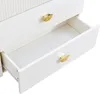 A close-up view of two drawers of a white dresser with gold fan-shaped handles. One drawer is open, revealing the interior. Anteprima dell’immagine prodotto