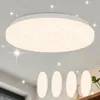 A modern, round LED ceiling light with a starry sky effect is shown mounted on a white ceiling. Below it, four smaller, oval-shaped lights are displayed, possibly as a set or related products. Produktbild-Vorschau