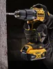 A person wearing gloves is holding a DeWALT drill and drilling into a concrete wall. Anteprima dell’immagine prodotto