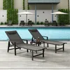 Two lounge chairs are set up on a wooden deck next to a swimming pool, with umbrellas in the background. Náhled obrázku produktu