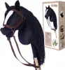 A black hobby horse with a brown bridle and reins, shown in front of a product box with images of children playing with similar toys. Anteprima dell’immagine prodotto
