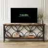 A modern console table with a rustic wood top and black metal frame, featuring decorative circular cutouts. A television is placed on top, and decorative items are on the shelf below. Náhľad obrázku produktu