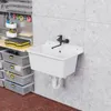A utility sink and storage bins in a workshop or garage setting. Produktbild-Vorschau